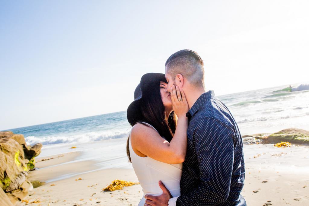 Engagement photos on the beach in la jolla ca. Candid couples portraits on Windansea beach.