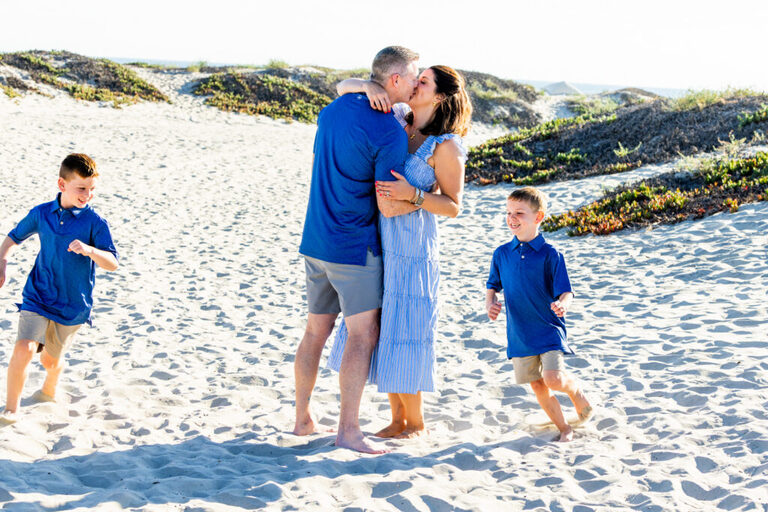 Generations of family enjoying time together during a Coronado beach portrait session