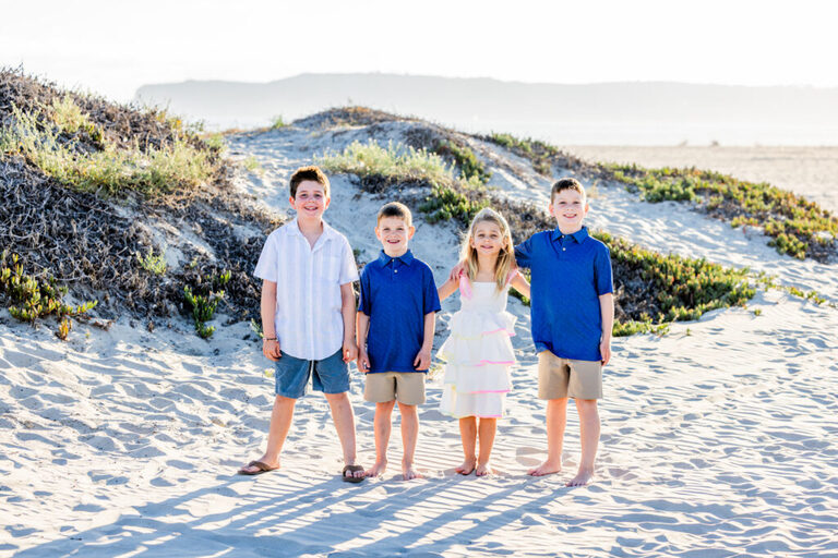 Extended family smiling together during a relaxed Coronado family portrait session