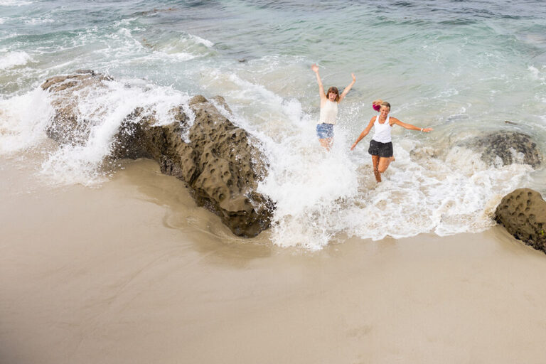 two women playing on the beach in la jolla