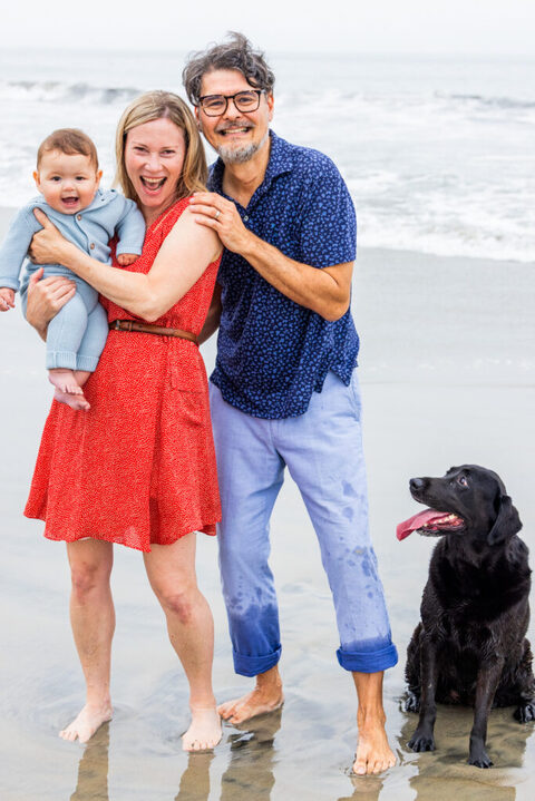 Family lifestyle photography with a baby and dog along the Coronado shoreline