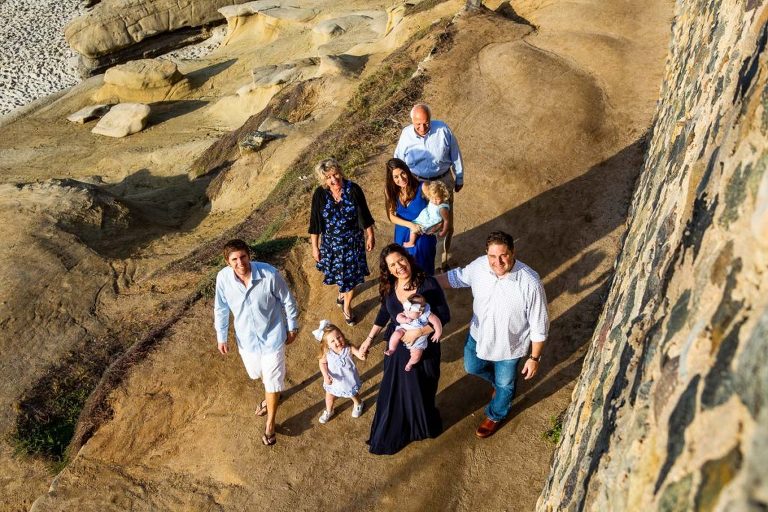 family walking on cliff