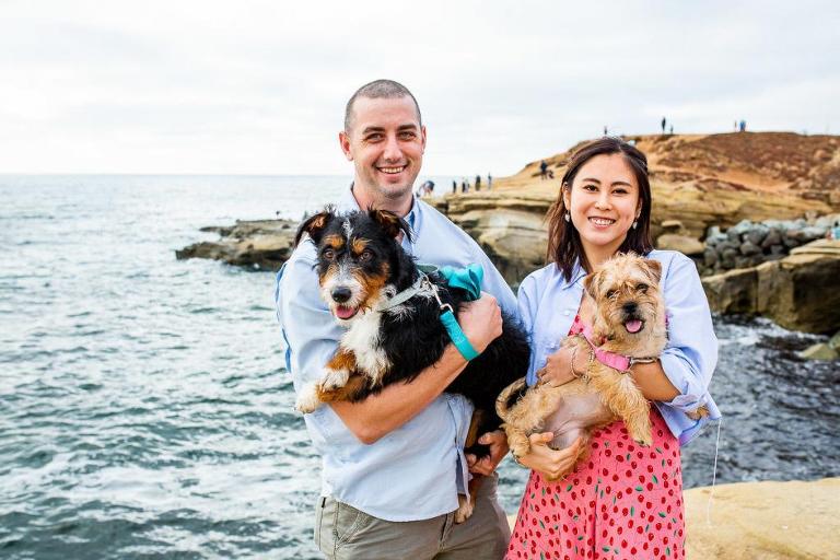 engagement photos at sunset cliffs in san diego with their dogs