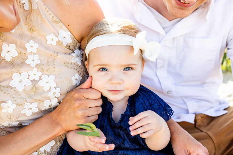 baby girl with pinched cheek photo